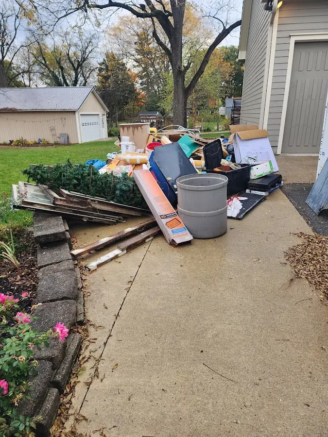 Dumpster being loaded with debris for Demolition Dumpster Rental in Scottsbluff